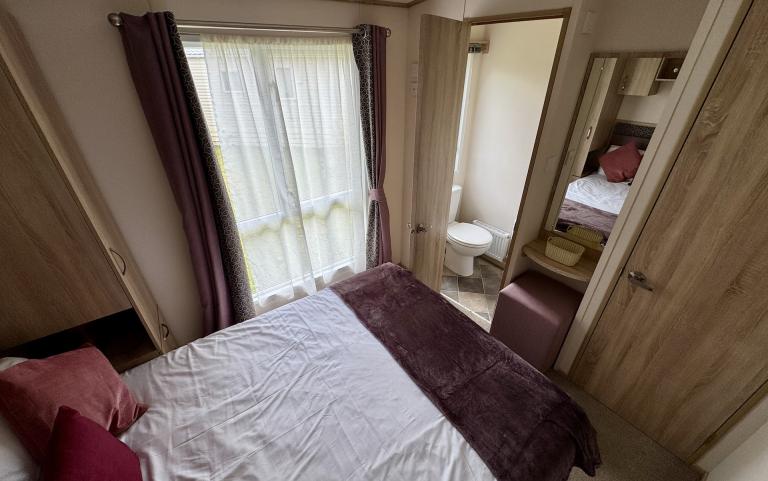 Interior of Master bedroom with double bed.