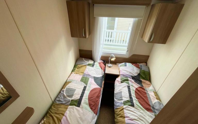 twin bedroom in the 2016 Swift Loire 28x12