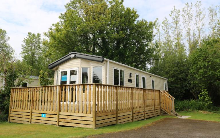 Outside of static caravan with wooden decking