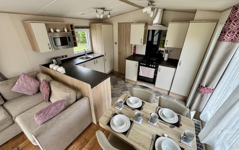 Interior view of the dining space with adjacent kitchen.