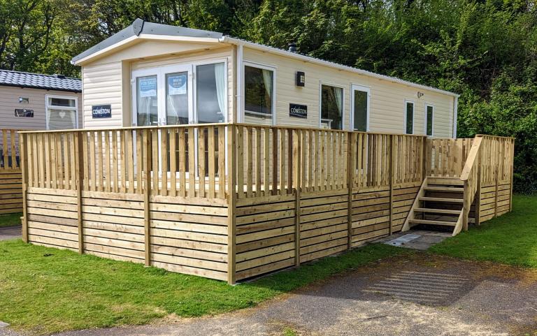 Exterior of caravan with wooden decking