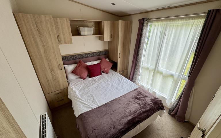 Interior of Master bedroom with double bed.