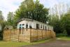 Outside of static caravan with wooden decking