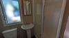 Bathroom with sink, shower, and toilet 