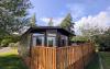 Exterior of wooden lodge with decking 